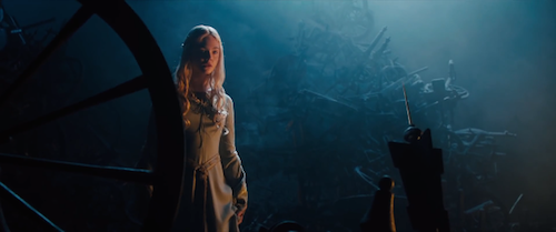Aurora (Elle Fanning) just moments away from pricking her finger on the needle of a spinning wheel